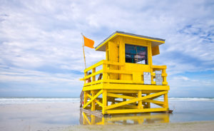 Yellow flag on lifeguard tower