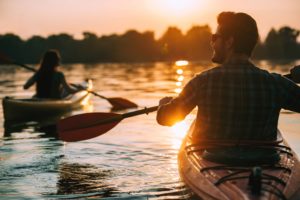 Couple Kayaking at sunset