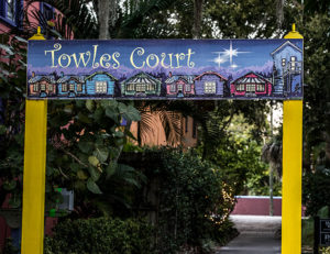 sign with Towles Court written on it