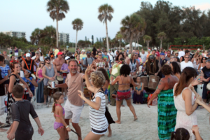 People dancing on beach