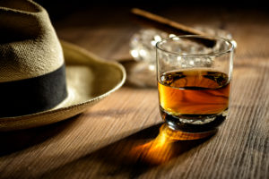 Glass of Rum, cigar, and hat