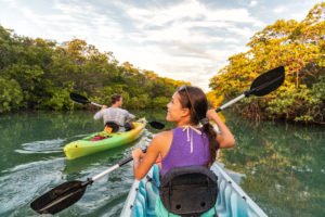 Couple kayaking through florida