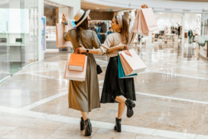 Two girls shopping at the mall