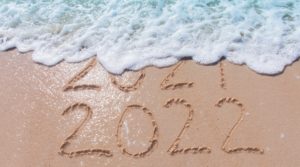 Goodbye 2021, Hello 2022 depicted in the sand on the beach