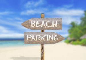 Classic wooden sign beach parking