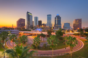 Tampa, Florida, USA downtown city skyline over roads and highways at dusk.