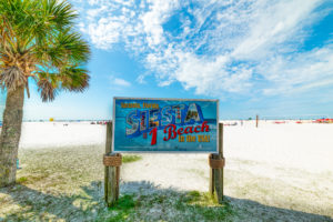 Sarasota, USA - February 25, 2019: Siesta Beach sign on a clear day