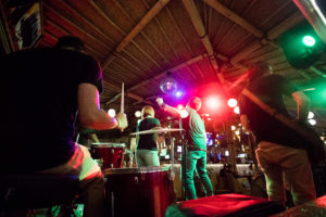 Live band performing at a beach bar and restaurant at night