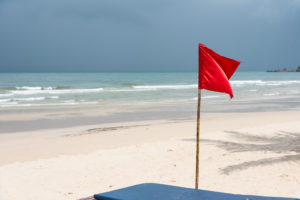 Red flag on a beach