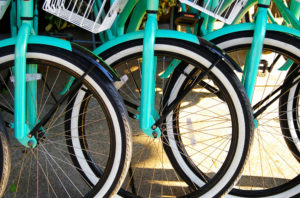 Bright colored tourist rental bikes lines up