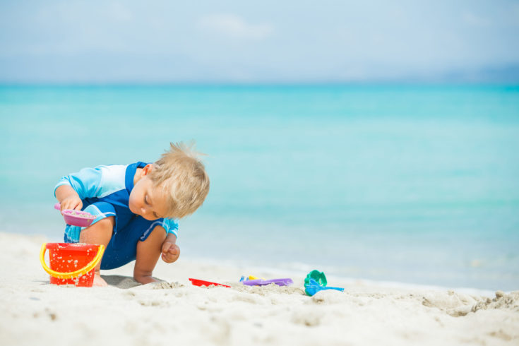 Cute,Baby,Boy,Playing,With,Beach,Toys,On,Tropical,Beach