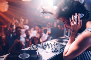 Young,Woman,Playing,Music,At,The,Club