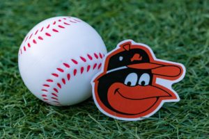 September 26, 2022, Cooperstown, New York. Baltimore Orioles baseball club emblem and baseball.