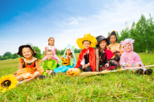 Kids in Halloween costumes outside